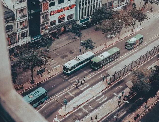 Ho Chi Minh City, Vietnam: street view with buses to Cu Chi Tunnels from Ho Chi Minh City