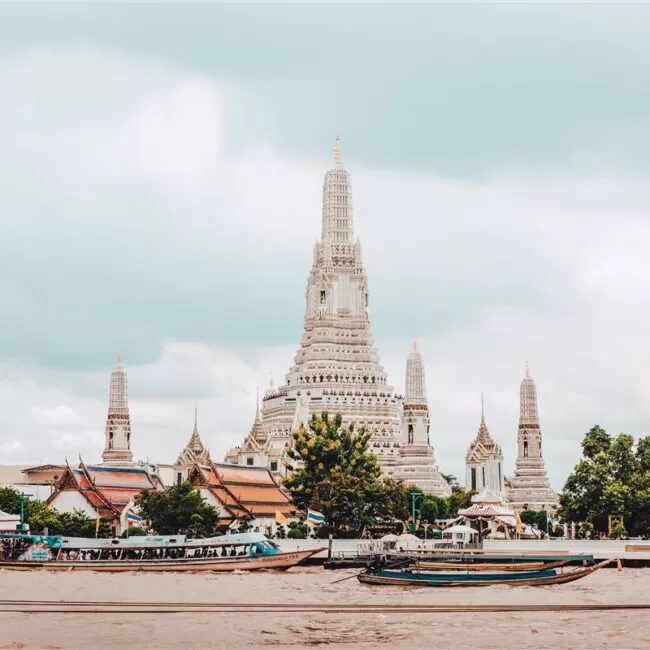 The majestic towers of Wat Arun that stand tall over Bangkok and the Chao Phraya River in Thailand