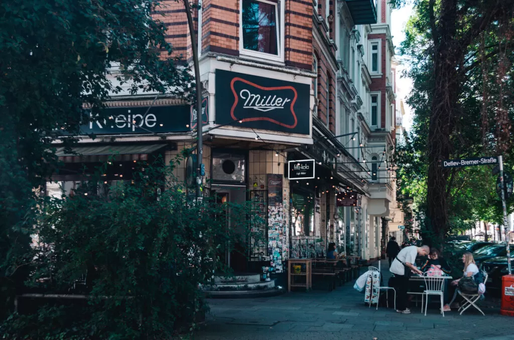 Cafe Miller, The facade of this plant-based restaurant in St. Pauli with cozy outdoor seating