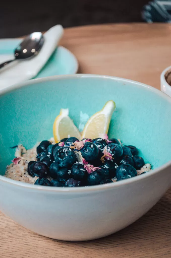 Good One, a vegan café in Hamburg. This is photo of their weekly changing oatmeal bowl. This one is with blueberries and lemon.