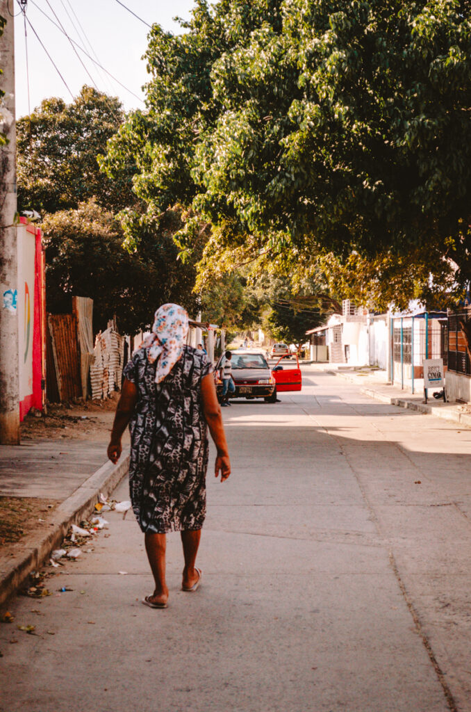 Dibulla town, Colombia- local woman walking down the street