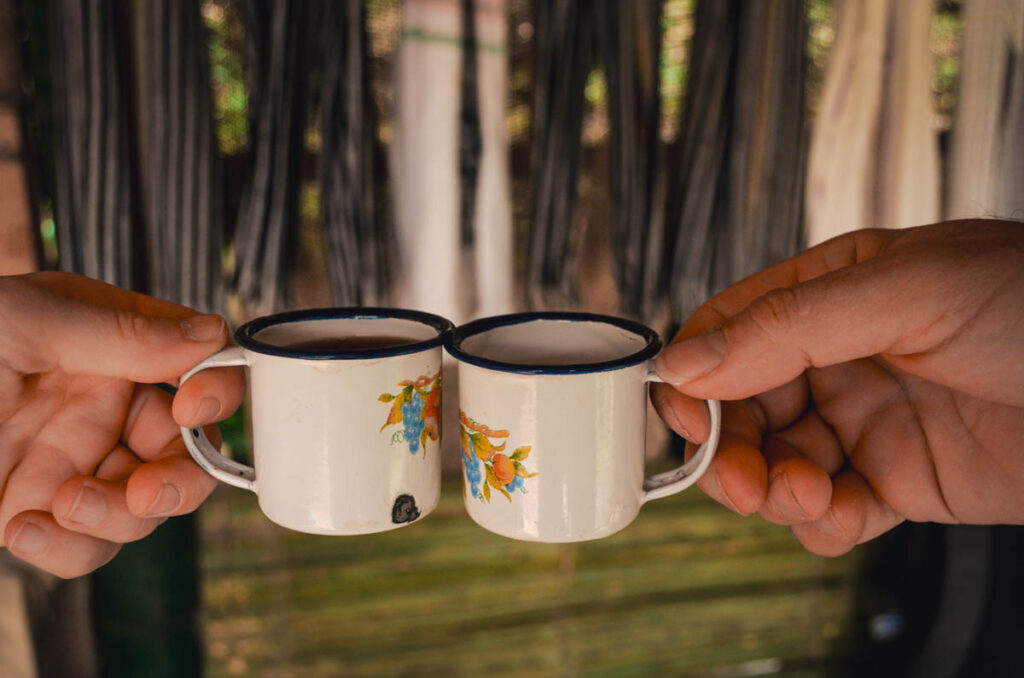 Lugar coffee tour, Salento, Colombia. This photo are two cups of fresh coffee doing a toast.
