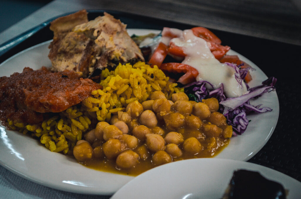 Main plate with chicpeas, rive, lasagna and salad at Pita's buffet, Medellin, Colombia