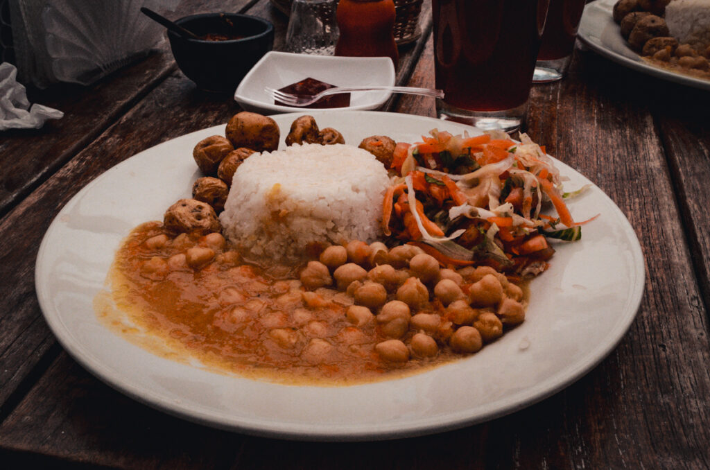 Naturally vegan Colombian food: A plate of rice, chickpea stew, salad and potatos at Estacion 20 03, Villa de Leyva, Colombia