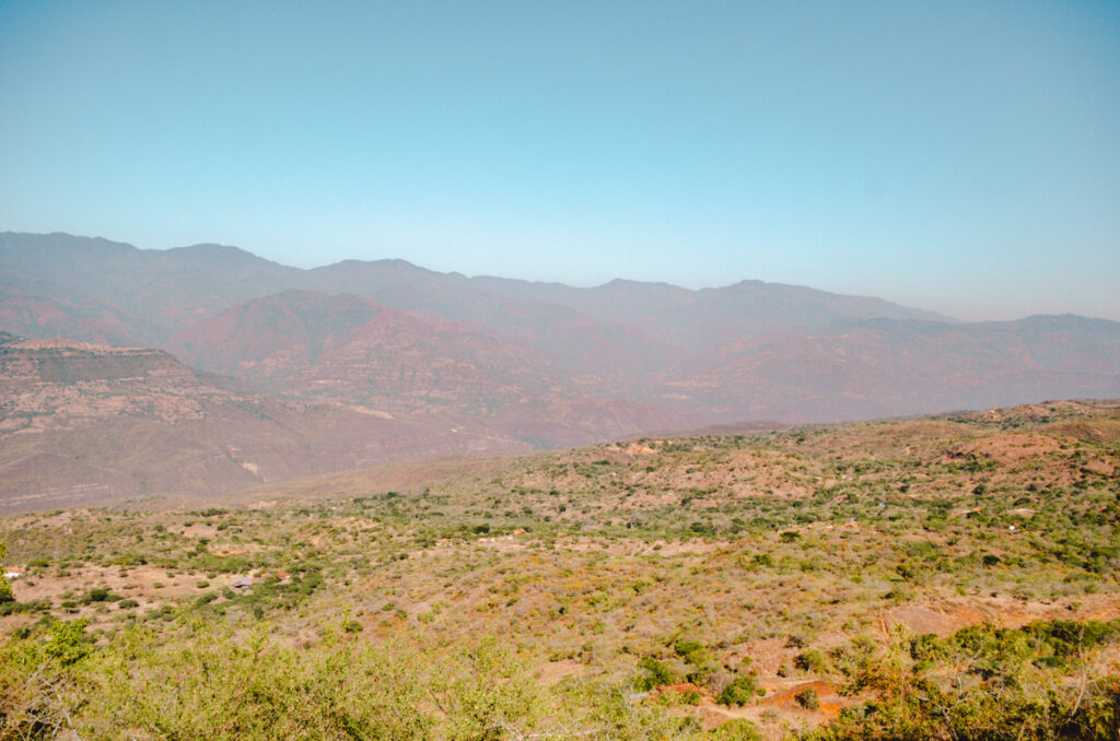 Majestic Barichara mountain vista with a hazy blue sky seen from one of the viewpoints in town.