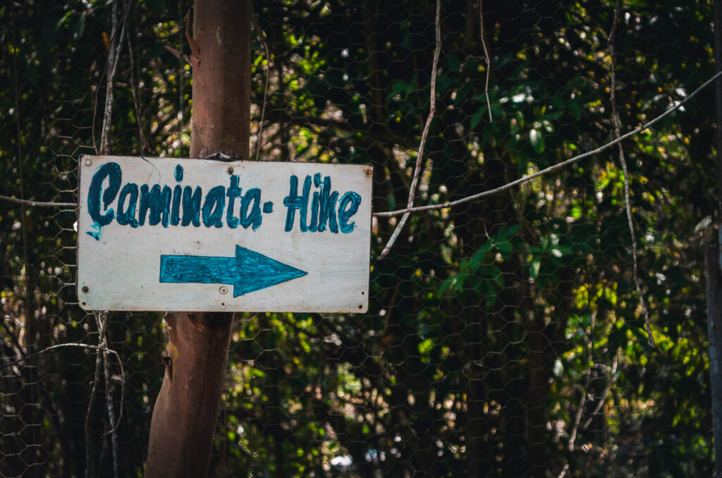 Caminata hike entrance sign, close to Juan Curi Waterfall.